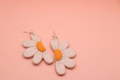 Half Daisy polymer clay earrings, available in white and orange.   ---------------------------------- Please note each item is handmade and therefore may differ slightly from the pictures.  To clean your clay earrings simply wipe with a damp cloth. To get the longest life out of your earrings we suggest removing them before swimming, showering, sleeping or apply product to your face and hair. Cute Hand Painted White Jewelry, Cute White Hand Painted Jewelry, White Polymer Clay Flower Earrings For Everyday Wear, Everyday White Flower Earrings In Polymer Clay, Everyday White Polymer Clay Flower Earrings, Hand Painted White Clay Jewelry, White Polymer Clay Flower Earrings For Gift, White Hand Painted Polymer Clay Flower Earrings, White Clay Earrings For Gift