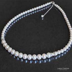 Wedding White Pearl Silver One Row Classic Bridal Statement Necklace. PLEASE READ ITEM DESCRIPTION and SHOP POLICIES before placing your order, and contact me with any questions! NECKLACE is about 18.50 inches (47cm) long. BRIDAL EARRINGS SECTION:https://www.etsy.com/shop/LanaChayka?ref=seller-platform-mcnav&section_id=11638940 BRIDAL BRACELETS SECTION: https://www.etsy.com/shop/LanaChayka?ref=seller-platform-mcnav&section_id=11638942 BRIDAL NECKLACES SECTION: https://www.etsy.com/shop/LanaChayka?ref=seller-platform-mcnav§ion_id=11638944 BRIDAL JEWELRY SETS SECTION: https://www.etsy.com/shop/LanaChayka?ref=seller-platform-mcnav§ion_id=25839214 Elegant and timeless, this beautiful necklace is perfect for weddings or special occasions such as birthdays, anniversaries, graduations, proms...or Elegant Single Strand Bridal Necklace For Wedding, Classic Bridal Necklace For Wedding, Classic Pearl White Bridal Necklace For Wedding, Elegant Single Strand Necklace For Wedding, White Single Strand Necklace For Wedding, Classic Pearl Chain Jewelry For Weddings, Round Pearl Embellished Jewelry For Wedding, Single Strand Pearl Necklace For Wedding, Classic Silver Necklace For Mother Of The Bride