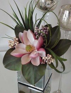 a vase filled with flowers on top of a table