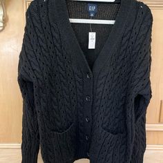 Nwt. 95% Polyester, 5% Wool. Cable Knit Front And Sleeves, Shaker Knit Back. 2 Front Patch Pockets. Black Cable Knit Cardigan For Layering, Gap V-neck Fall Sweater, Black Cable Knit Casual Cardigan, Casual Black Cable Knit Cardigan, Gap Knit Sweater For Fall, Casual Gap V-neck Sweater, Casual V-neck Sweater By Gap, Casual Gap Winter Cardigan, Casual Winter Cardigan By Gap