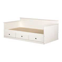 a white day bed with drawers on the bottom and bottom drawer open to reveal a mattress