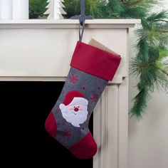 a christmas stocking hanging from a fireplace mantel