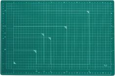 a green cutting mat that has been cut into smaller squares and lines on it, with one line in the middle