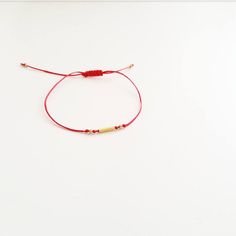 Dainty Handmade Name Bracelet For Friendship, Handmade Minimalist Friendship Bracelets As Gift, Minimalist Red Beaded Bracelets As Gift, Gift Bangle Jewelry With Sliding Knot, Dainty Adjustable Red Bracelet, Dainty Red Bracelet With Sliding Knot, Handmade Minimalist Friendship Bracelet As Gift, Dainty Red Adjustable Bracelet, Red Minimalist Beaded Bracelet Gift