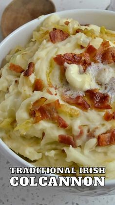 a white bowl filled with mashed potatoes and bacon