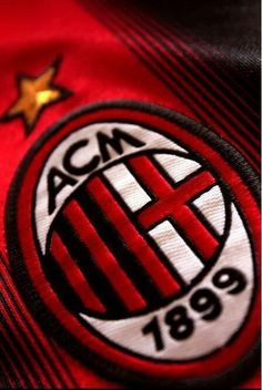 acm logo on the shirt of a soccer player