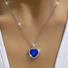 This Beautiful Necklace Features A Heart-Shaped Pendant With A Dark Blue Zircon Stone And A Sparkling Cubic Zirconia Accent. The Necklace Has A Lobster Closure And Measures Approximately 18 Inches In Length, With A 2-Inch Extender. The Blue Color Of The Pendant And Chain Adds A Touch Of Elegance To Any Outfit, Making It Suitable For Any Occasion. This Necklace Is A Lovely Gift For Someone Special Or A Treat For Yourself. The Necklace Is Made In China And Has A Chain And Pendant Style. Its Theme Blue Heart Cut Jewelry For Party, Blue Jewelry For Valentine's Day Party, Blue Heart Necklace For Gift, Blue Heart Pendant Jewelry For Party, Blue Heart Necklaces For Party, Blue Heart Necklace For Anniversary, Elegant Blue Heart Necklace For Valentine's Day, Blue Sterling Silver Heart Necklace For Valentine's Day, Blue Heart Necklace With Charm For Anniversary