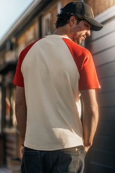 Discover the Chariot Henley in a New Shade.Introducing the Chariot Henley in a vibrant red hue, a striking addition to our collection that captures the essence of both American baseball and British heritage. This garment embodies the perfect fusion of two iconic cultures, delivering an unrivalled blend of sporting heritage and comfort. Baker Boy Hat, Henley T Shirt, Baker Boy, Black Tree, British Heritage, The Untamed, Scarf Gift, British Design, Travel Companion