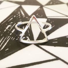 I handcraft each triangle ring out of tarnish resistant Argentium sterling silver square wire. I give it high polish for a clean modern look. It's strong and sturdy for everyday wear and care. Each ring is made to order just for you! P R O D U C T I O N ~ T I M E : Depending on my current amount of orders, it usually takes me 1-2 weeks to craft your item. Message me if you need a rush order! Send questions my way anytime! Peace & Gratitude, ♥Ali Rae Additional ~ D E T A I L S What is Argenti Modern Adjustable Hypoallergenic Stackable Rings, Modern Silver Hypoallergenic Stackable Rings, Modern Hypoallergenic Silver Stackable Rings, Nickel-free Adjustable Modern Midi Rings, Adjustable Modern Nickel-free Midi Rings, Modern Adjustable Nickel-free Midi Rings, Modern Hypoallergenic Sterling Silver Rings, Modern Adjustable Midi Rings Nickel-free, Modern Nickel-free Open Midi Rings