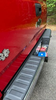 the tailgates on a red pickup truck