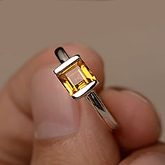 square citrine ring, citrine wedding ring, yellow citrine ring, natural citrine ring, dainty citrine ring, carnelian rings ★ To change the metal to a 10k/ 14k/ 18k solid gold (white/rose/Yellow) is also available, please ask for a quotation if you want. Stone Details : Variety - Natural Square Cut Yellow Citrine Weight: 1.24 CT 1 gem Size: 6 x 6 mm Shape: Square Metal Stamp: 925K/10K/14K The basic metal is sterling silver and plated with rhodium. To change the metal to a solid gold (white/rose/Y Yellow Citrine Topaz Ring Rectangular Shape, Yellow Topaz Crystal Promise Ring, Yellow Square Cut Ring For Anniversary, Yellow Square Cut Rings For Gift, Minimalist Yellow Ring For Anniversary, Minimalist Yellow Rings For Anniversary, Rectangular Citrine Wedding Rings, Yellow Citrine Rectangular Rings, Yellow Rectangular Citrine Ring