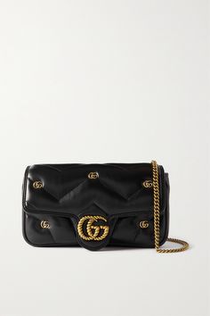 'Marmont' is one of Gucci's most iconic collections, so naturally, every new addition creates a lot of buzz. This mini '2.0' shoulder bag has been made in Italy from supple matelassé leather and is detailed with twisted and micro versions of the label's 'GG' logo. The interior will easily hold a wallet and phone. Gucci Rectangular Bag With Gold-tone Logo Plaque, Gucci Rectangular Shoulder Bag With Gold-tone Logo, Luxury Gucci Bag With Gold-tone Logo Plaque, Gucci Super Mini, Gucci Marmont, Gucci Gg Marmont, Closet Organizer, Gg Logo, Gg Marmont