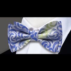 Elevate Your Elegance: The White, Green, and Blue Silk Bow Tie with Abstract Sophistication In the realm of refined accessories, our White, Green, and Blue Silk Bow Tie stands out as a masterpiece of elegance. This bow tie transcends convention, boasting a captivating abstract pattern that weaves together the purity of white silk with the refreshing hues of green and blue. Delve into the details as we explore the versatility and sophistication that this silk bow tie brings to your wardrobe. The Tan Suit, Festive Wedding, Kinetic Energy, Navy Blue Suit, Silk Bow Ties, Blue Or Pink, Pre Tied Bow Tie, Silk Bow, Summer Soiree