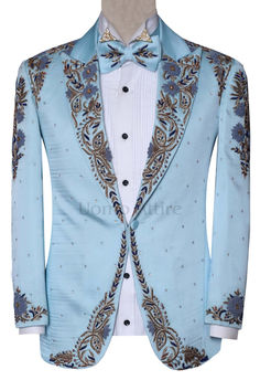 Step out in style with this exquisite baby blue luxury designer wedding tuxedo suit. Made with premium quality fabric and adorned with stunning hand embroidery, this tuxedo is the perfect choice for your big day. Blue Tuxedo Blazer For Ceremonies, Blue Tuxedo Style Blazer For Ceremonies, Fitted Blue Sets For Reception, Blue Fitted Sets For Reception, Elegant Blue Blazer For Ceremony, Blue Luxury Wedding Sets, Fitted Blue Embroidered Blazer, Luxury Blue Wedding Sets, Luxury Blue Sets For Groom