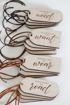 four wooden tags with words on them that read, i want something new to read