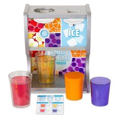 an assortment of different colored glasses and cups