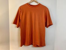 This is a 90s / Y2K era orange striped skater style t-shirt made by Penman's. 100% cotton material. It is a US Mens Size L. In good vintage condition - please review all photos for details! Approx. measurements laying flat: ~25 inch length ~23 inches pit to pit ~9 inch sleeve ⊹ Bundle Discounts ⊹ Buy 2 items and save 20% with code: BUY2SAVE20 Buy 3 or more items and save 30% with code BUY3SAVE30 90s Striped Short Sleeve Tops, Retro Striped T-shirt For Streetwear, 90s Striped Crew Neck Top, Striped 90s Style T-shirt For Summer, 90s Striped T-shirt For Summer, Striped 90s Style Summer T-shirt, 90s Striped Cotton T-shirt, Retro Striped Streetwear Tops, 90s Striped Short Sleeve T-shirt