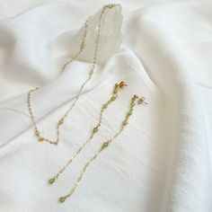 Ultra Tiny Peridot Necklace and Dangle Earring Set It is hand-crafted by me to order in Los Angeles  Thank you for shopping U & Mi :)  ✶MEASUREMENTS✶ - 14,18 and 30 inches with a 2 inch extender. - Earring Length: 4 inches  ✶MATERIALS✶ -14k gold filled chain -14k gold filled findings  -Silver -Peridot ✶GIVING AS A GIFT?✶ Jewelry will be packaged in a box and mailed in bubble mailer. If you would like to pick special label, please let me know! I offer three options:  1. Happy Birthday 2. Love 3. Best Friend ✶PROCESSING TIME✶ -Current processing time is 1-3 days. -Processing time is separate from shipping time. ✶SHIPPING✶ Free Shipping within the United States  General shipping time guidelines for USPS services -USPS First Class Package Services: 2-5 days -USPS Priority Mail: 1-3 days -USPS Green Peridot Jewelry For Gift, Handmade Peridot Jewelry For May Birthstone, Delicate Green Jewelry For Gifts, Delicate Green Dangle Jewelry, Delicate Green Birthstone Jewelry, Dangle Peridot Jewelry For Gifts, Peridot Dangle Jewelry As A Gift, Peridot Dangle Jewelry For Gift, Peridot Dangle Earrings For May Birthstone