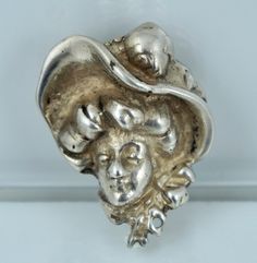 "A substantial Art Nouveau pin. This lovely pin features a figural image of a woman wearing a large hat and is crafted from solid sterling silver. The pin is clearly hallmarked \"STERLING\" and weighs an impressive 14.5 grams. It measures 1 1/4 inches top to bottom by 1 inch at the widest point. The pin is in excellent vintage condition and ready to wear! Always open to offers! Please ask any questions and free shipping anywhere in the USA!" Sterling Silver Hallmarked Brooches, Woman Profile, Large Hat, Flat Stone, Lapis Ring, Large Hats, Brooch Vintage, Pretty Rings, Ring Photos