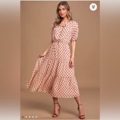 Nowt Blush Pink Polka Dot Tiered Midi Dress! Textured Woven Fabric, Covered In Brown Polka Dots, Shapes This Classy And Timeless Dress With A Ruffle-Trimmed Rounded Neckline, With A Tying Detail And Front Cutout, That Falls To A Button-Front Bodice, Framed By Short Puff Sleeves (With Elasticized Cuffs). Elasticized Waist Tops A Tiered Midi Skirt With A Flouncy Hem. Fully Lined. Self: 100% Polyester. Lining: 100% Polyester. Hand Wash Cold. No Holes, Stains Or Tears. Fast Shipper Smoke Free Feel F Polka Dot Swiss Dot Midi Dress, Flowy Polka Dot Midi Dress, Feminine Polka Dot Dress For Brunch, Flowy Polka Dot Dress For Brunch, Feminine Polka Dot Midi Dress For Spring, Spring Midi-length Swiss Dot Maxi Dress, Tiered Midi Skirt, Brown Polka Dots, Timeless Dress