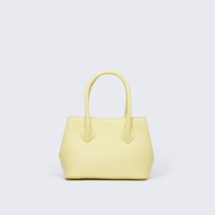 Material: Pebbled genuine cow leather. Interior: Lined with canvas Color: Yellow Height: 15.7 cm 6.2 inch Length: 20.3 cm 8 inch Depth: 8.9 cm 3.5 inch Weight: 0.7 Kg 1.54 Lb. Affordable Yellow Versatile Bag, Yellow Top Handle Bags, Yellow Tote Bag With Top Carry Handle, Luxury Yellow Box Tote Bag, Yellow Soft Leather Bag For On-the-go, Yellow Purses, Yellow Top, Givency Antigona Bag, Pastel Yellow