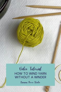 A small greenish yellow center-pull ball of yarn on a white background with knitting needles, a crochet hook, a yarn bowl, and a small brass crescent shape. An aqua panel with text reads: Video tutorial. How to wind yarn without a winder. Banana Moon Studio. How To Wrap Yarn Into A Ball, Diy Yarn Ball Winder, How To Wind A Center Pull Ball Of Yarn, Yarn Winder Diy, Diy Yarn Winder, How To Wind Yarn Into A Ball, Cheap Yarn