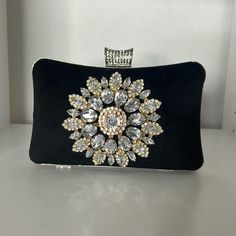 Nwot Black Velvet Embellished Clutch With Silver Chain Embellished With Beautiful Rhinestone Detailing With Gold Detailing Brand New Beautiful Condition No Brand Listed - Unsure The Brand Questions? Leave Me A Comment Below Luxury Black Embellished Clutch, Embellished Black Evening Bag For Night Out, Chic Embellished Formal Evening Bag, Black Embellished Bags For Formal Occasions, Black Embellished Formal Bag, Formal Black Embellished Bags, Embellished Black Rectangular Clutch, Black Embellished Rectangular Clutch, Black Evening Bags With Bling