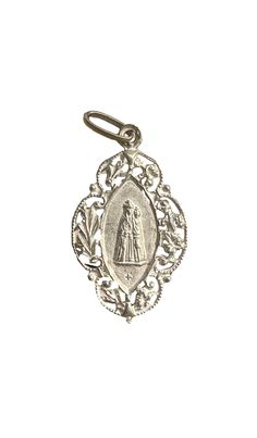 This is an antique  religious medal, depicting Our Lady of Chevremont, made of sterling silver. The Chapelle of the English Jesuits or Our Lady of Chevremont is a small Catholic religious building on the hill of Chevremont. Built in the 17th century by English Jesduits in exile in the Principality of Liège, the chapel became a center of Marian worship and pilgrimage. Increasing numbers of pilgrims led, at the end of the19th century, to the construction the great basilica. It is in good antique c Engraved Spiritual Medallion Jewelry, Engraved Coin-shaped Spiritual Jewelry And Charms, Engraved White Gold Spiritual Jewelry And Charms, Silver Miraculous Medal For Wedding, Silver Miraculous Medal Jewelry For Wedding, Miraculous Medal Medallion For Commemoration, Vintage Sterling Silver Miraculous Medal, Miraculous Medal Pendant For Wedding, Vintage Sterling Silver Miraculous Medal Jewelry