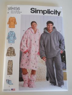 a man and woman in pajamas standing next to each other with hoods on them