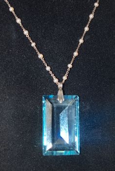 I love the large jewel on this necklace! It is 1 1/2 inches by 7/8 inch and has a sterling bale. The necklace is sterling and has French hallmarks on the catch. The tiny pearls are made of glass and are not real. The chain length is 15 1/2 inches. The total effect is just lovely. In nice condition with some tiny flea bits to the jewel. French and C. 1930. Follow me on instagram @jettesjewels Art Deco Pearl Pendant Jewelry, Blue Jewelry With Large Pendant For Formal Occasions, Blue Rectangular Pendant Jewelry For Formal Occasions, Formal Blue Jewelry With Large Pendant, Art Deco Pearl Pendant Necklace As Gift, Blue Necklace With Large Pendant For Anniversary, Blue Anniversary Necklaces With Large Pendant, Formal Blue High Luster Jewelry, Formal High Luster Blue Jewelry