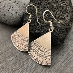 Simple yet beautiful silver triangular earrings, with small hand stamped details. Perfect earrings for any occasion, easy to match to any outfit. This are flat and light weight what makes them easy to wear. A pair to wear and never take off. They are 3.4cm- 1.45inch long 3.3cm- 1.30inch wide. They have a drop length of 5cm- 2 inch A unique addition to your jewelry collection. To see more unique silver earrings, click the link below https://www.etsy.com/shop/AkashiJewelry?ref=seller-platform-mcna Triangle Metal Earrings For Gift, Stamped Metal Earrings For Gifts, Nickel-free Triangle Earrings As Gift, Nickel Free Triangle Metal Earrings, Nickel-free Metal Triangle Earrings, Nickel-free Triangle Bohemian Jewelry, Nickel-free Bohemian Triangle Jewelry, Bohemian Stamped Earrings, Bohemian Triangle Nickel-free Jewelry