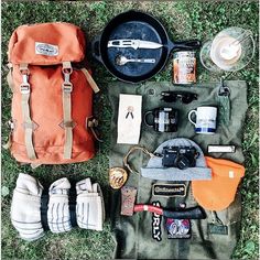 an assortment of camping items laid out on the ground