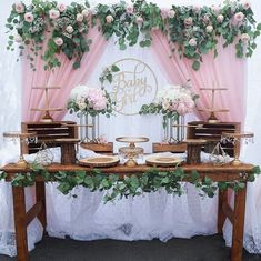 the table is set up with flowers and candles on it for an elegant wedding reception