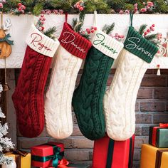 three christmas stockings hanging from a mantel