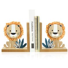 two wooden lion bookends are shown next to a ruler on a white background