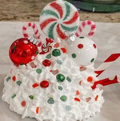 a christmas cake with candy and candies on top