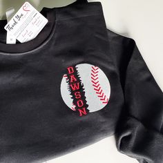 Introducing our Personalized Baseball Sweatshirt, the ultimate choice for baseball enthusiasts! This Embroidered Custom Name Baseball Crewneck is perfect for showcasing your love for the game. Whether you're gearing up for game day or simply cheering from the sidelines, this sweatshirt is a must-have for any baseball lover. With its custom embroidery featuring your name, it's a unique and thoughtful gift for yourself or any baseball fan in your life. Get ready to hit a home run in style with our College Baseball Jersey With Team Name And Crew Neck, Varsity Baseball Jersey With Team Name, Long Sleeve T-shirt For Baseball Game Day, Baseball Jersey With Team Spirit Style, Crew Neck Baseball Jersey For Game Day, Sporty Crew Neck Baseball Jersey For Fans, Team Spirit Baseball Jersey With Crew Neck For College, College Baseball Jersey With Crew Neck, Collegiate Baseball Jersey Crew Neck For Sports Events