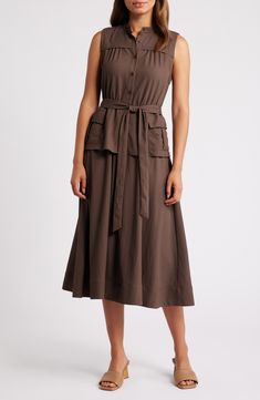 Cargo pockets lend utilitarian flair to a sleeveless midi dress cast in a delightfully earthy hue. 46" length (size Medium) Front button closure Band collar Sleeveless Side cargo flap-patch pockets Removable tie belt Unlined 65% polyester, 35% nylon Dry clean Imported A-line Sleeveless Dress With Pockets For Work, Olive Sleeveless Midi Dress, Khaki Sleeveless Dress With Pockets, Chic Sleeveless Khaki Midi Dress, Sleeveless Workwear Dresses With Slip Pockets, Knee-length Sleeveless Dress With Pockets For Work, Khaki Sleeveless Dress For Work, Midi-length Sleeveless Dress With Pockets For Work, Midi Length Sleeveless Workwear Dress With Pockets