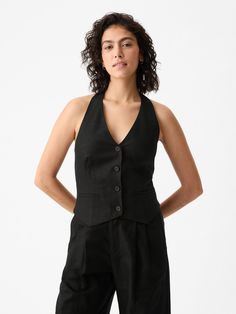 Soft linen-cotton vest.  Halter neckline.  Sleeveless.  Button front.  Welt pockets at front.  Smocked back.  * Fit: Slightly fitted.  Sits close to the body.  Hits at the hip.  Models wearing Gap