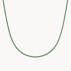 The Evergreen Tennis Necklace from our Eden Collection embodies the radiant beauty of the Garden of Eden. Available in widths of 1.70 mm and 3 mm and lengths of 35 cm and 40 cm, this necklace is adorned all around with sparkling emeralds set in 14kt recycled gold. The emeralds shine in an intense green and have been meticulously set by hand to enhance their natural brilliance. The Evergreen Tennis Necklace is a timeless piece of jewelry that adds a special touch to any outfit and stands out with Radiant Beauty, The Garden Of Eden, Garden Of Eden, Tennis Necklace, Recycled Gold, Timeless Pieces, Eden, The Garden, Tennis