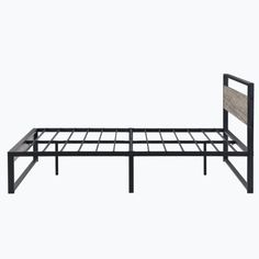 a metal bed frame with a wooden headboard and foot board on the bottom side