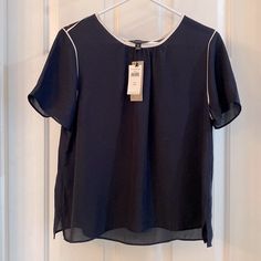 So Many Ways To Wear This! New With Tags Banana Republic Short Sleeve Blouse. Size Is Medium Petite, So Runs Shorter In The Length. Color Is Navy Blue With White Contrast Piping Around The Neck And Along The Sleeve Seams. Lightweight And Slightly Shear. Casual Crew Neck Blouse For Office, Casual Crew Neck Office Blouse, Elegant Blue Crew Neck Top, Navy Short Sleeve Blouse For Summer, Navy Tops For Office In Spring, Navy Tops For Office Spring Season, Casual Navy Short Sleeve Blouse, Navy Casual Blouse For Workwear, Elegant Navy Short Sleeve Tops