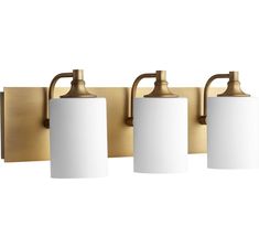 three light bathroom fixture with brass finish and white glass shades on the front, one wall mounted