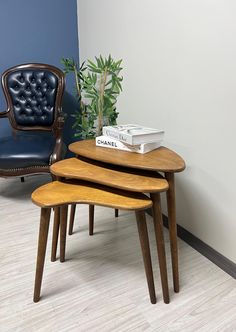 three wooden tables sitting next to each other