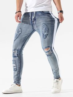 Details:Side Stripe \nDetails:Ripped \nClosure Type:Zipper Fly \nColor:Light Wash \nPattern Type:Colorblock \nType:Skinny \nWaist Line:Natural \nLength:Long \nFit Type:Regular Fit \nFabric:Slight Stretch \nMaterial:Denim \nComposition:76% Cotton \nComposition:22% Polyester \nComposition:2% Elastane \nCare Instructions:Machine wash, do not dry clean \nBody:Unlined \nSheer:No \n Side Ripped Jeans, Ripped Jeans Men, Side Stripe, Ripped Jeans, Panel Siding, Mens Jeans, Color Blocking, Siding, Dry Clean