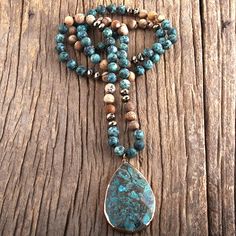 This necklace has a unique and striking beauty from three kinds of pure and high-grade Jasper with immense healing and nurturing benefits: Blue Ocean Jasper, African Jasper and Picture Jasper stones. Blue ocean jasper is among the popular jasper varieties you will come across. It bears orb-like nodules from silicic fluid forming in the circular nucleus cluster. These nodules fuse with sedimentary elements and create banded layers that give the gemstone its bewildering beauty. Ocean Jasper assist Turquoise Agate Spiritual Crystal Necklace, Spiritual Turquoise Agate Crystal Necklace, Bohemian Moss Agate Necklaces For Meditation, Healing Jasper Necklaces With Natural Stones, Spiritual Agate Turquoise Necklace For Healing, Healing Jasper Necklace With Natural Stones, Spiritual Turquoise Agate Necklace For Healing, Spiritual Jasper Beaded Necklace With Gemstone, Spiritual Turquoise Necklace With Natural Agate Stones