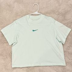 Girl’s Nike Sportswear Essentials Boxy Tee; Mint Foam; Size L; Never Worn; 100% Cotton; Excellent Condition Nike Cropped Short Sleeve T-shirt For Sports, Trendy Sports Cropped T-shirt With Crew Neck, Sporty Cotton Cropped T-shirt For Sports, Sportswear Cropped T-shirt For Sports, Trendy Cotton Cropped T-shirt For Sports, Trendy Green Sports Top, Blue Short Sleeve Sportswear Top, Blue Letter Print Sportswear Tops, Blue Sporty Cropped Crew Neck T-shirt