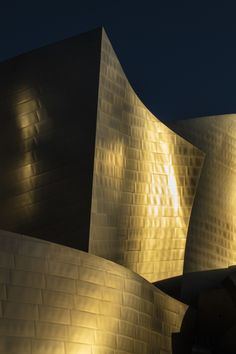 the exterior of walt concert hall lit up at night with bright lights shining on it