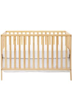 a wooden crib with white sheets on the bottom and side rails, against a white background