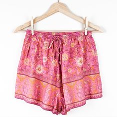 Spell Shorts Are A Summer Staple, And This Pair Is No Exception! Featuring Spell's Utopia Print In A Cheerful Blend Of Bright Pink, Orange, And Cream, These Shorts Are Perfect For Pairing With All Your Neutral Tops--Or Get A Little Wild And Do A Pattern Clash! They Feature A Stretchy Elastic Waist With Drawstring Tie And A Relaxed, Comfortable Fit. These Shorts Are Lightweight And Perfect For Hot Weather! They Could Work For A Size Small, Depending On Desired Fit. Specifications 100% Organic Cot Pattern Clash, Flamingo Color, Neutral Tops, Summer Staples, Hot Weather, Pink Orange, Bright Pink, Flamingo, Elastic Waist